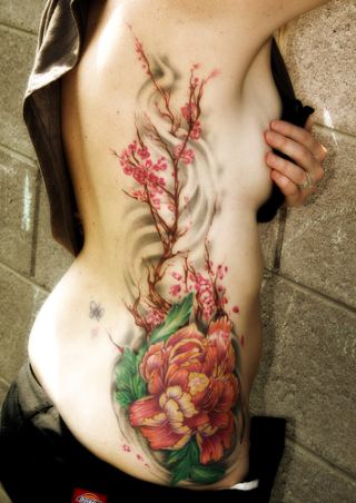 girl flower tattoos. girl flower tattoos