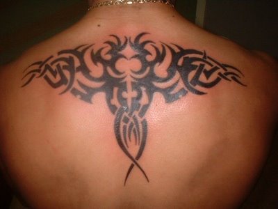 Tribal Aries Tattoos painted on upper back. butterfly tattoos on upper back 