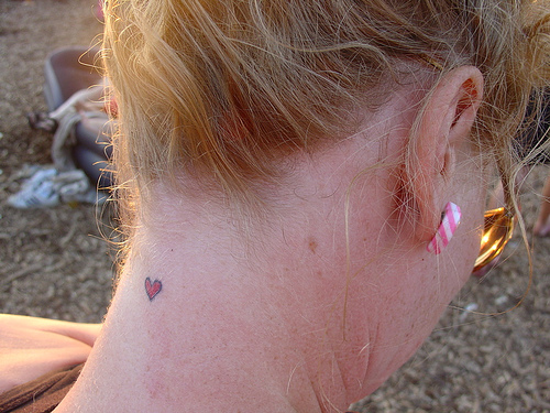 Small heart tattoos are popular with men and women alike
