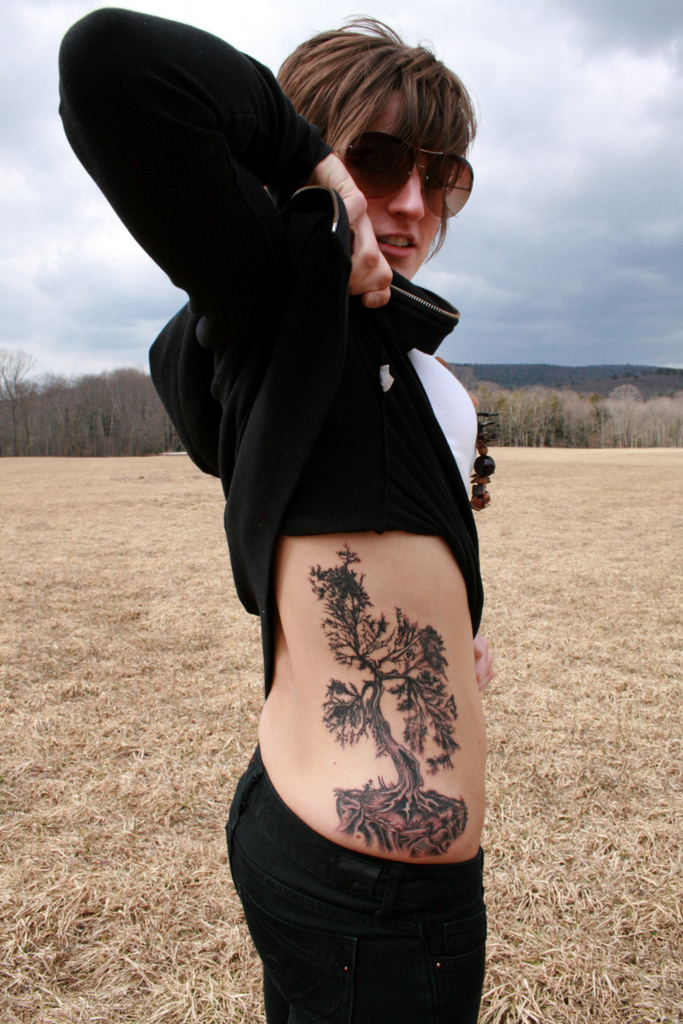cherry blossom tree tattoo on back. (wilted cherry blossom tree